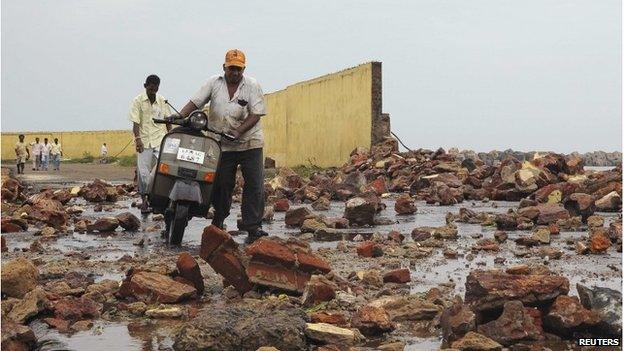 Debris from storm damage at a fishing harbour in Visakhapatnam district, Andhra Pradesh, India, 12 October 2013