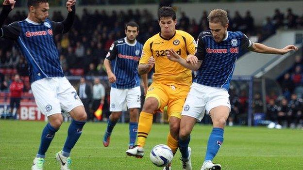 Newport’s Danny Crow is outnumbered by the Rochdale defence