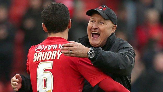 Russell Slade celebrates with his players