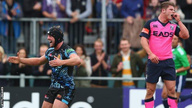 Cardiff's Harry Robinson (right) looks on as Exeter's Dean Mumms celebrates a try