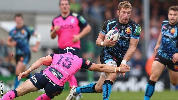 Exeter wing Matt Jess charges past the tackle of Blues full-back Leigh Halfpenny