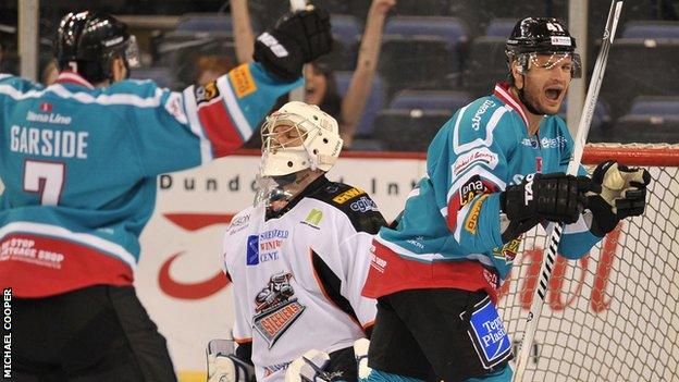 Adam Keefe of the Belfast Giants celebrates after scoring the third goal past Frank Doyle of the Sheffield Steelers during the 4-2 win in Elite League