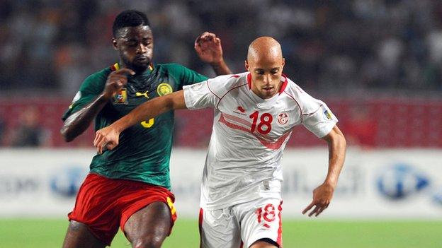 Cameroon's Alex Song and Tunisia's Yassin Mikari