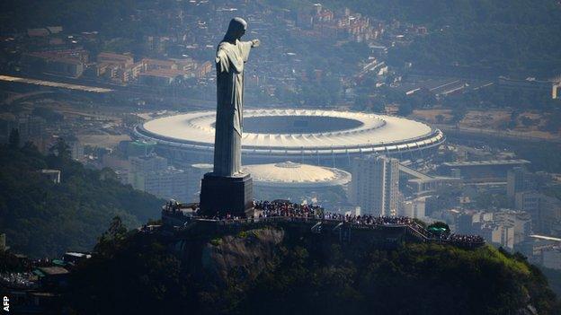 The iconic Christ the Redeemer statue in Rio with the Maracana below