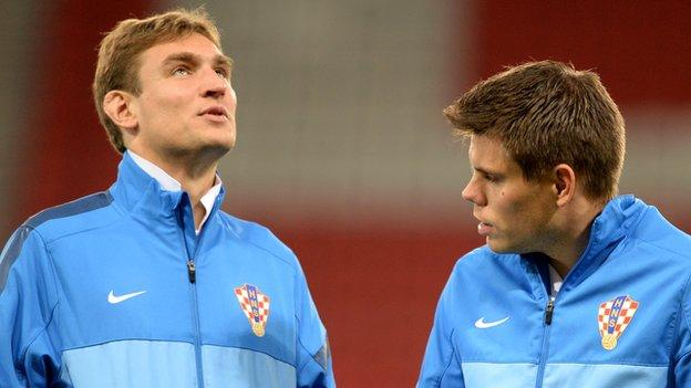 Nikica Jelavic (left) looks round Hampden