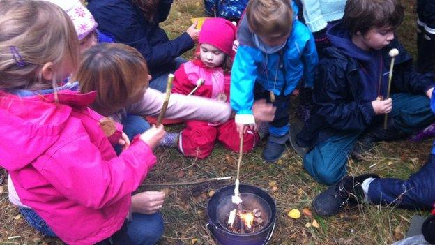 Children toasting marshmallows