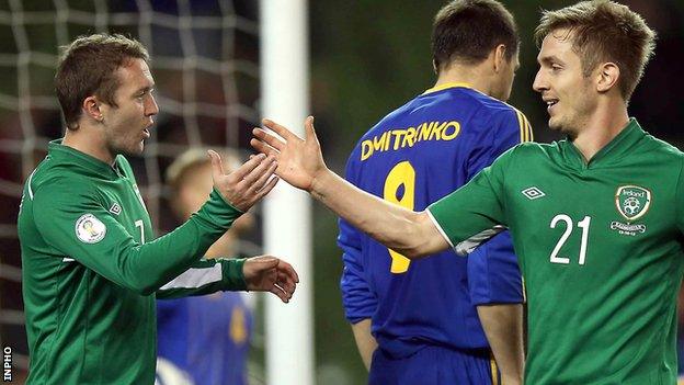 Aiden McGeady and Kevin Doyle celebrate the Republic's third goal