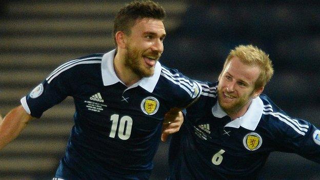 Robert Snodgrass celebrates his goal for Scotland with Barry Bannan