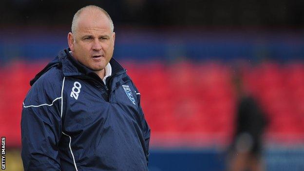 Mike Rayer observes a Bedford Blues warm up