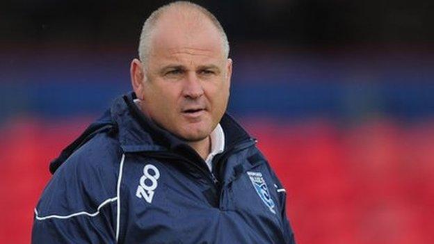 Mike Rayer observes a Bedford Blues warm up