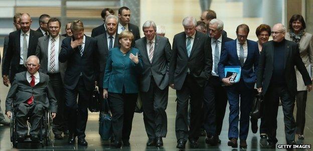 Angela Merkel (centre) leads her party to talks with the Greens in Berlin, 15 October