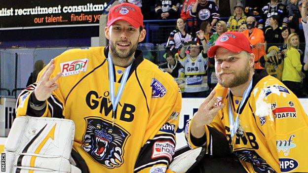 Dan Green and Craig Kowalski celebrate winning the Elite League trophy in April