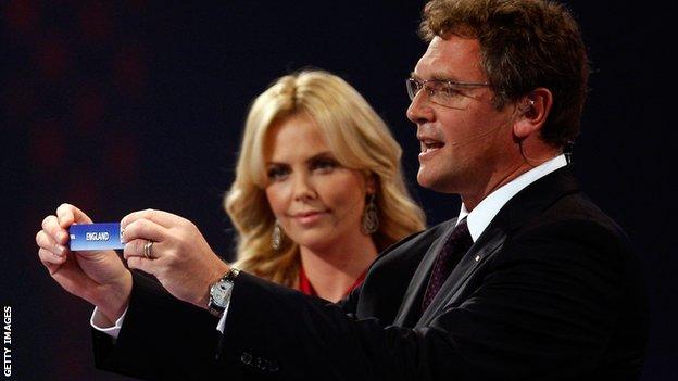 Jerome Valcke and Charlise Theron at the World Cup draw in 2009