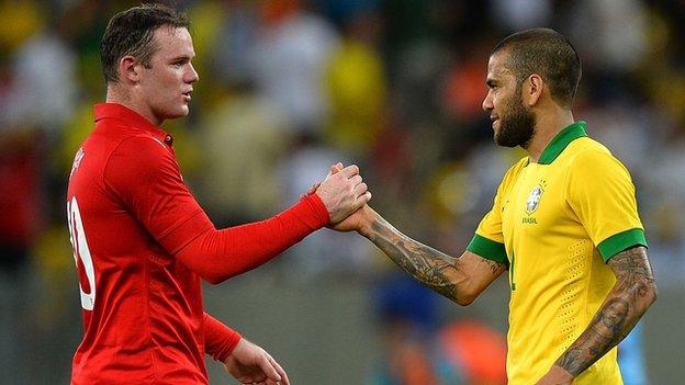 Wayne Rooney and Dani Alves