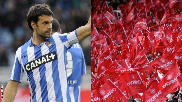 Xabi Prieto and Manchester United flags