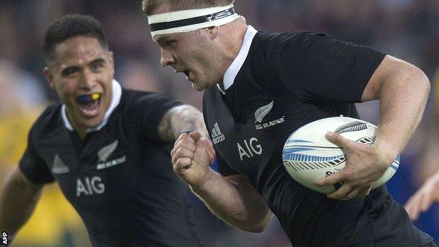 Flanker Sam Cane carries the ball on the way to scoring New Zealand's second try against Australia