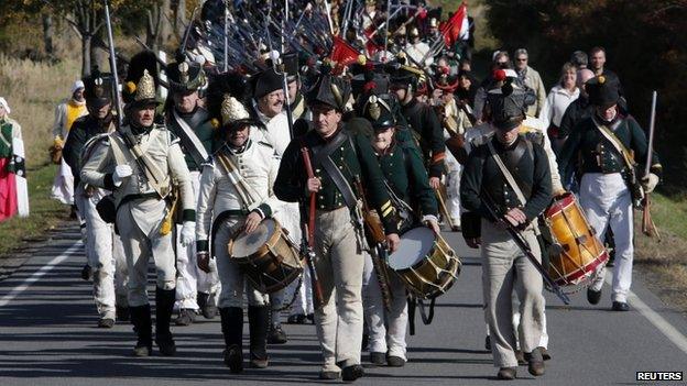 Performers in 19th Century Saxon military uniforms practised marching
