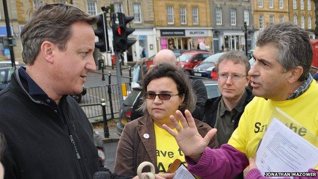 David Cameron in Chipping Norton being confronted by ACE Centre protesters