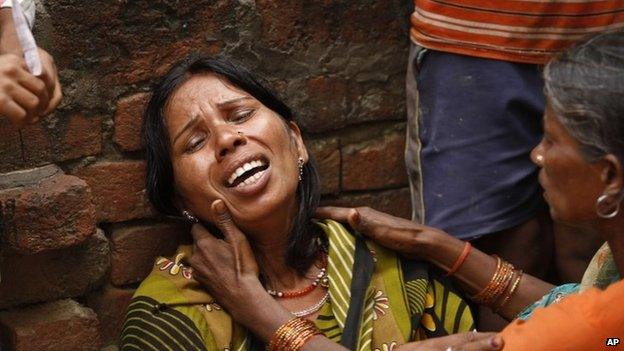 Poonam, whose two relatives died after drinking toxic liquor, wails at Atardiha village in Azamgarh district, on Sunday, Oct 20, 2013