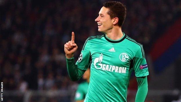 Julian Draxler of Schalke celebrates his team's first goal during the Uefa Champions League Group E match between FC Basel and Schalke 04