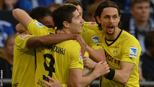 Borussia Dortmund players celebrate after scoring against Schalke