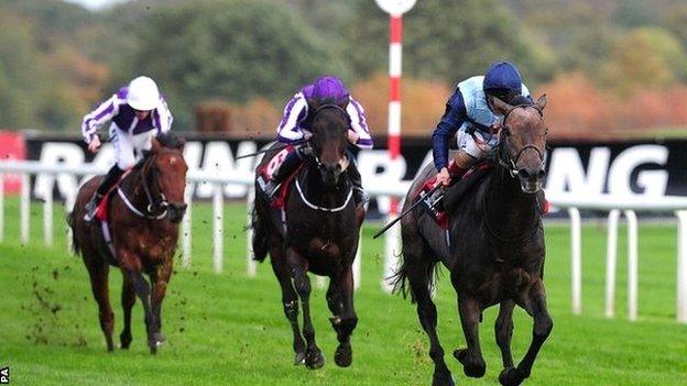 Kingston Hill and Andrea Atzeni (right) race to victory at Doncaster