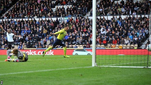 Birmingham's Lee Novak (centre) scores an equaliser at Derby