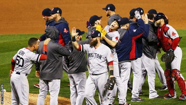 Boston Red Sox players celebrate victory over the St Louis Cardinals