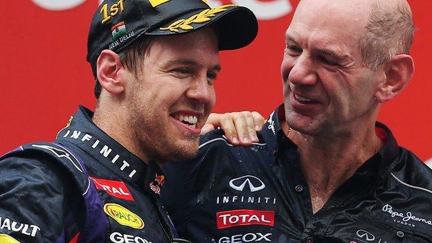 Sebastian Vettel celebrates with Red Bull's Adrian Newey