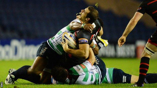 Edinburgh's Tim Visser is injured against Treviso