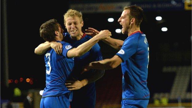 Graeme Shinnie and Richie Foran congratulate Gary Warren on his equaliser for Inverness