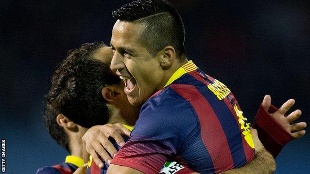 Alexis Sanchez of Barcelona celebrates scoring their opening goal against Celta Vigo