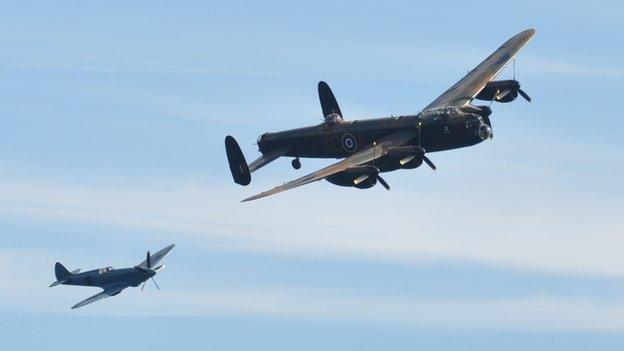 Battle of Britain Memorial Flight Lancaster and Spitfire taking part in Guernsey's air display in 2012