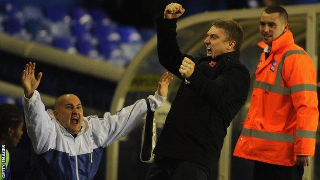 Birmingham manager Lee Clark (centre) celebrates an equaliser against Stoke in the League Cup.