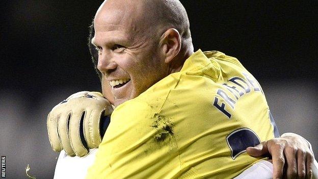 Brad Friedel celebrates Tottenham's Capital One Cup win