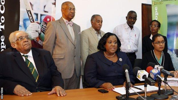 Jamaica's minister with responsibility for sports Natalie Neita-Headley (seated, centre) gives a news conference to discuss the visit by officials from the World Anti-Doping Agency with Herb Elliott (seated, left), chairman of the Jamaica Anti-Doping Commission (JADCO), Onika Miller (seated, right), permanent secretary of the Prime Minister, and other JADCO officials (standing).