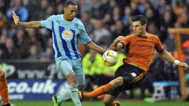 Callum Wilson (left) shoots for Coventry