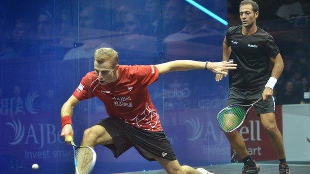 Nick Matthew plays a shot against Amr Shabana