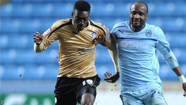 Colchester striker Freddy Ladapo (left)