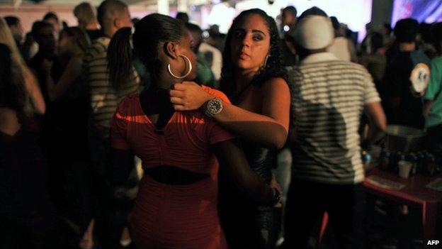 Two girls dance during a funk party at in Rio de Janeiro, on 25 March, 2012