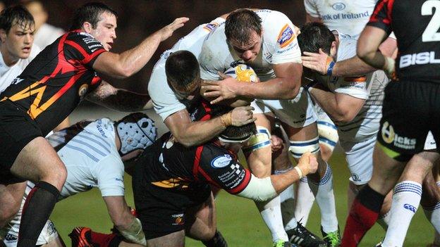 Leinster back-row Rhys Ruddock takes on the Dragons defence