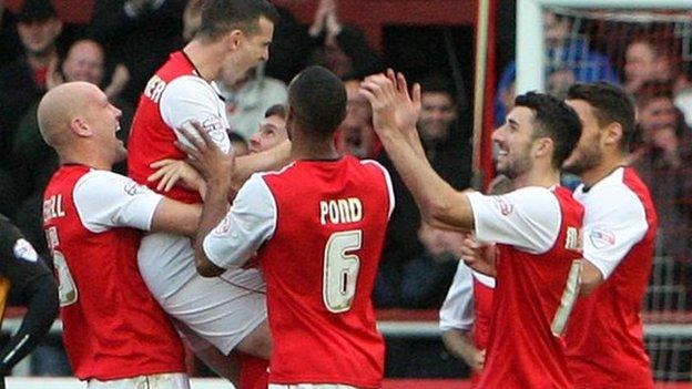 Steve Schumacher celebrates with his team-mates