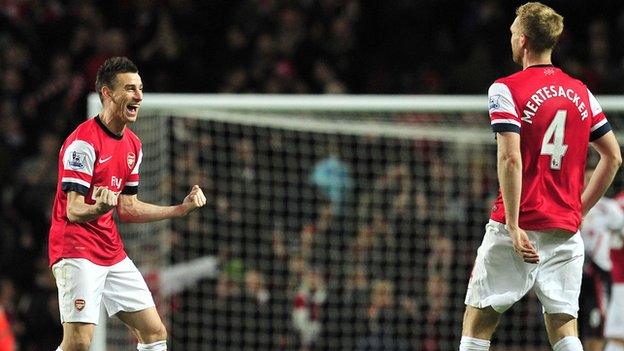 Laurent Koscielny and Per Mertesacker celebrate Arsenal's win