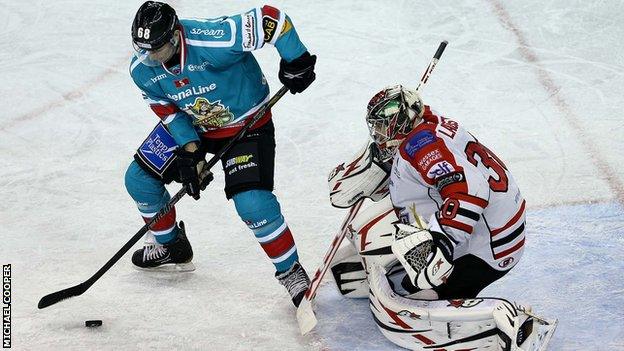 Belfast's Chris Higgins attempts to beat Devils netminder Daniel LaCosta