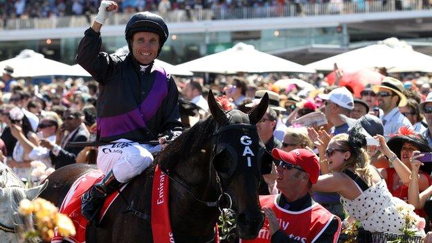 Jockey Damien Oliver wins the Melbourne Cup on Fiorente