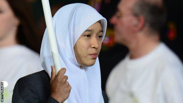 Maziah Mahusin carries the flag of Brunei at the London 2012 Olympic Games opening ceremony
