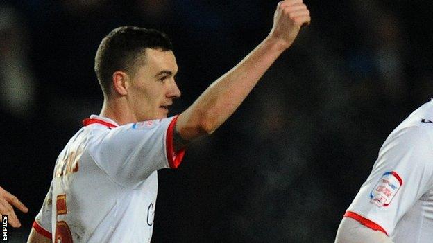 Shaun Williams celebrates scoring for MK Dons