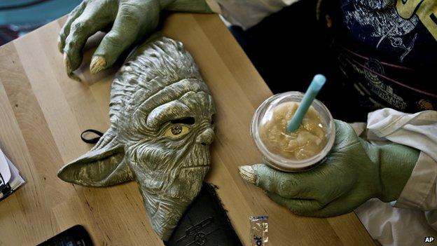 Yoda mask on a table in coffee shop