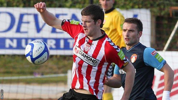 Ryan McBride shields the ball from St Pat's player Christy Fagan