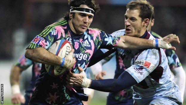 Stade Francais' Gonzalo Tiesi (left) fends off Bourgoin's David Janin